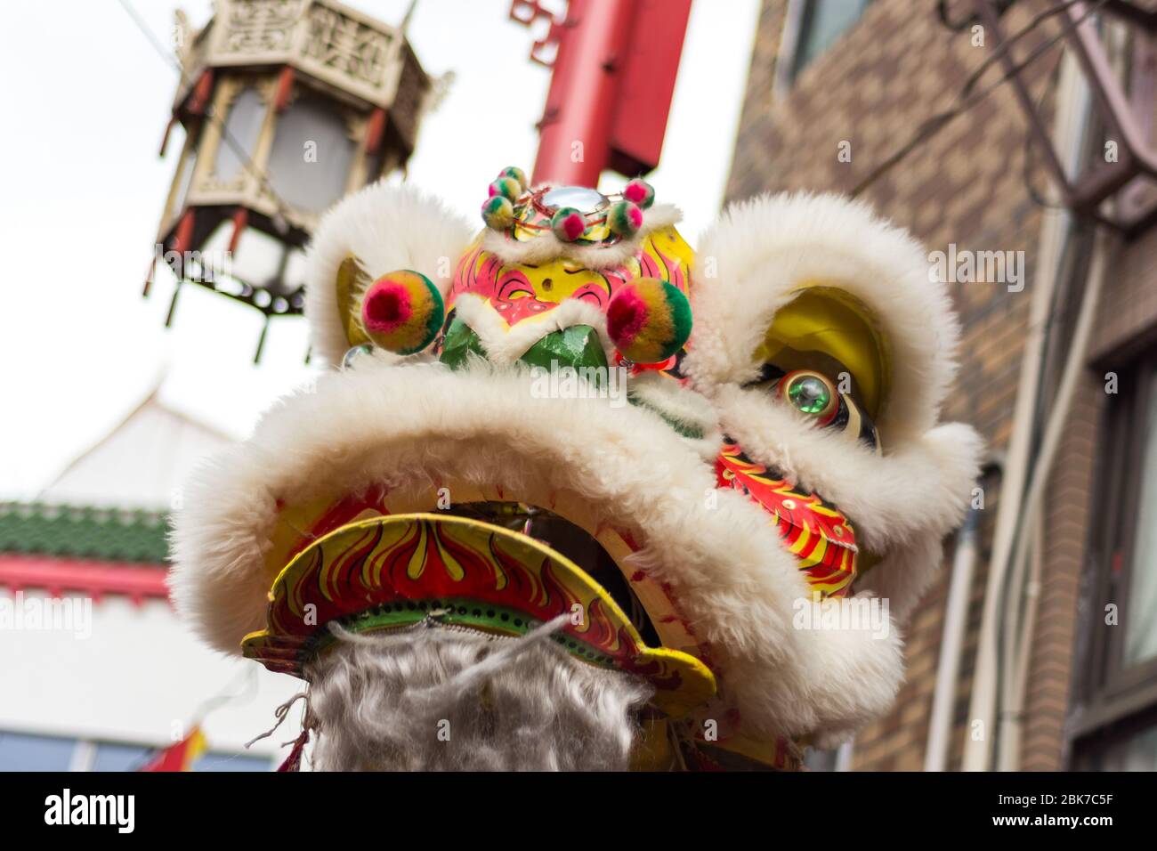 Traditional Dragon dance during Lunar New Year celebration in Chinatown in Kobe, Hyogo prefecture, Japan Stock Photo