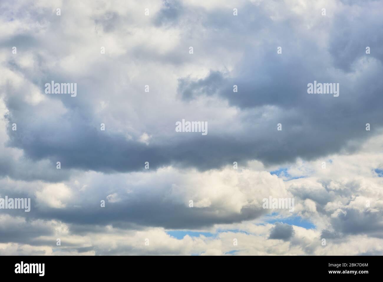 Background, storm clouds illuminated by sunlight Stock Photo