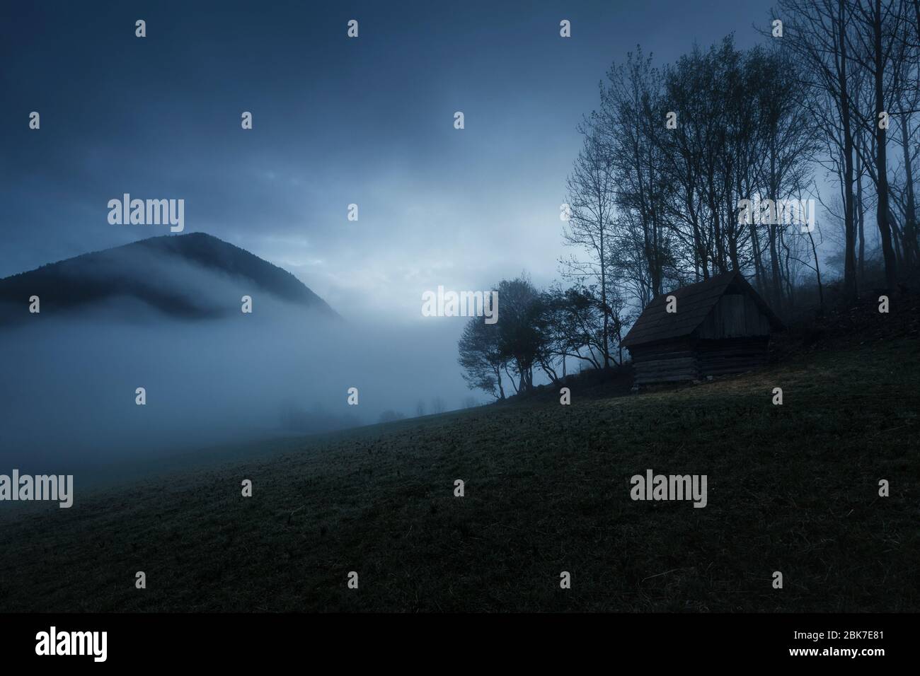 Foggy early spring morning landscape near Vlkolinec village. Stock Photo