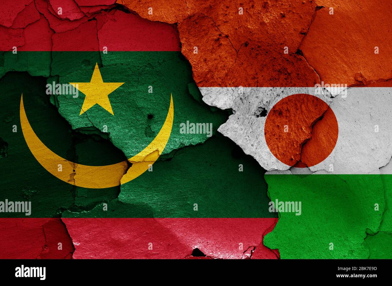 flags of Mauritania and Niger painted on cracked wall Stock Photo