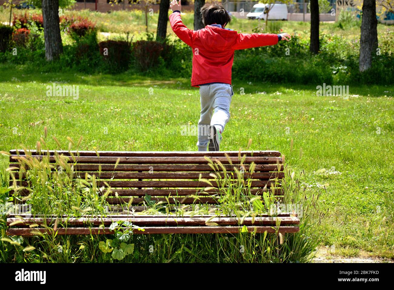 Boy playing at the park hi-res stock photography and images - Alamy