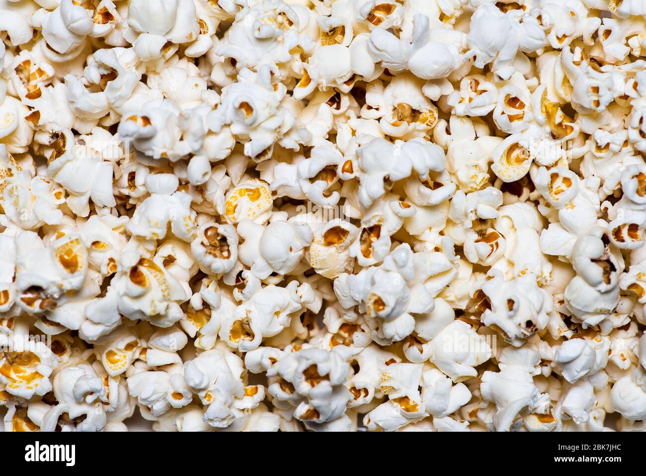 Popcorn background pattern flat lay, snack for a movie time Stock Photo