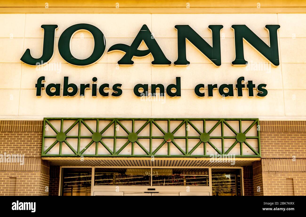 Charlotte, NC/USA - November 9, 2019: Closeup exterior horizontal shot of 'Joann Fabrics and Crafts' retail chain storefront above entrance showing br Stock Photo