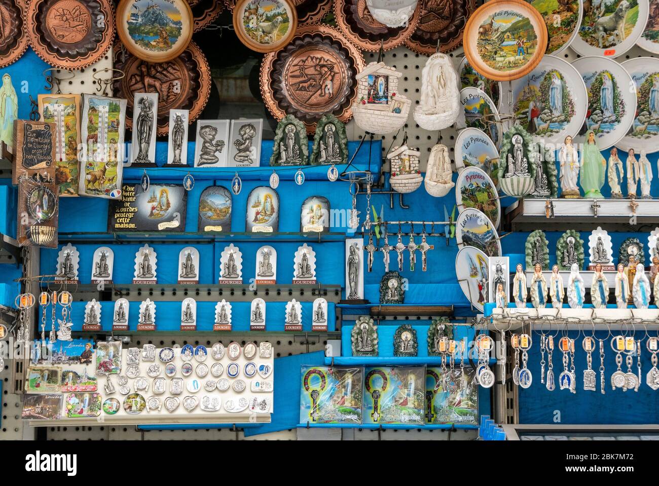 Souvenir shop with products featuring the Virgin Mary in Lourdes, France, Europe Stock Photo