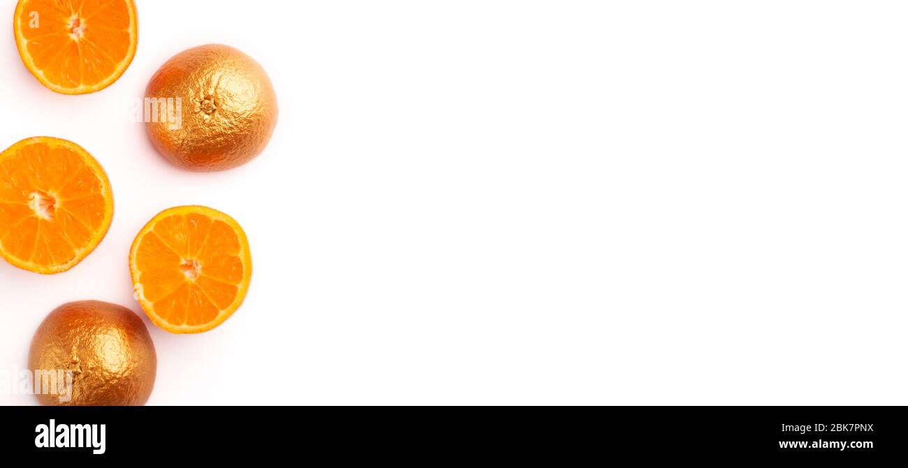 Cut orange and citrus in gold paint Stock Photo