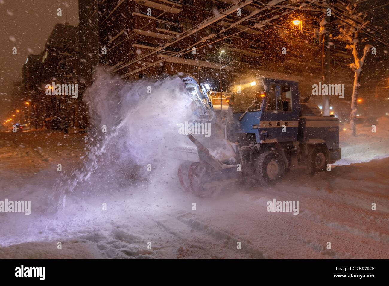 Snow Blower at Night, Sapporo, Japan Stock Photo