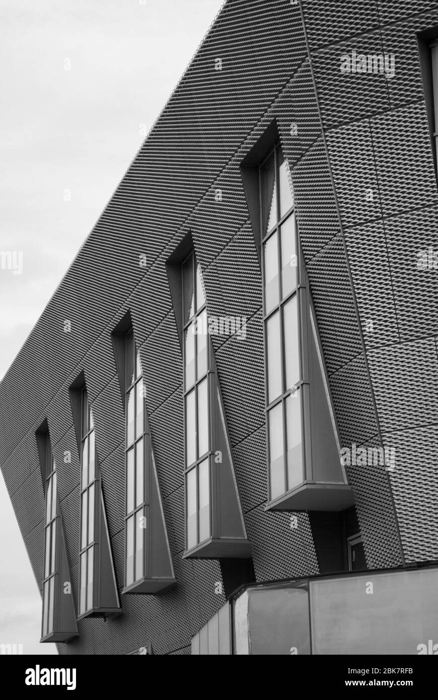 Perforated Bronze Aluminium Cladding Canada Water Library 21 Surrey Quays Road, Rotherhithe, London SE16 7AR by CZWG Architects Piers Gough Stock Photo