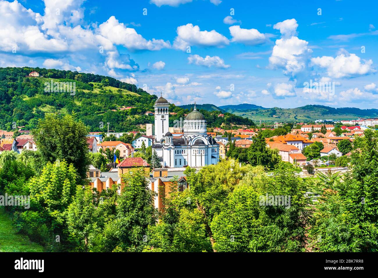 Sighisoara, Mures County, Transilvania, Romania: Landscape of The Holy Trinity (Stanta Treime) Orthodox church with the roof tops of surrounding homes Stock Photo