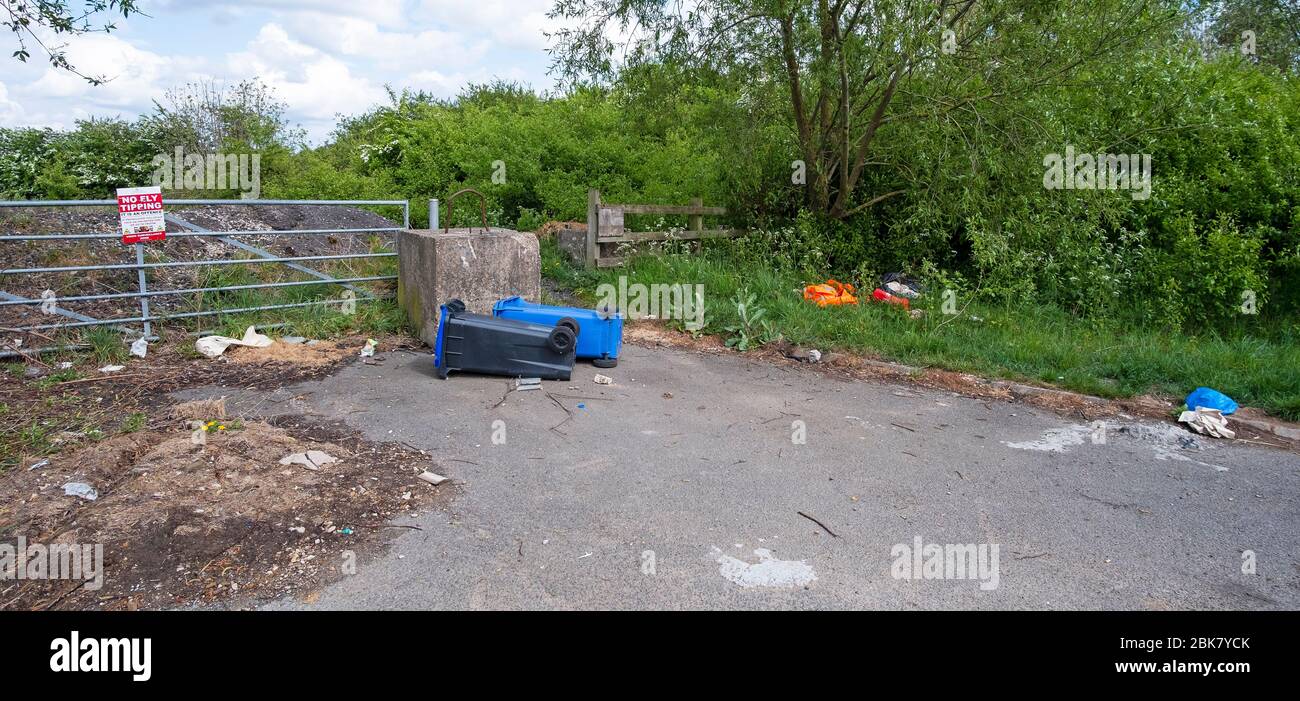 Abandoned wheelie bins at a fly tipping scene Stock Photo