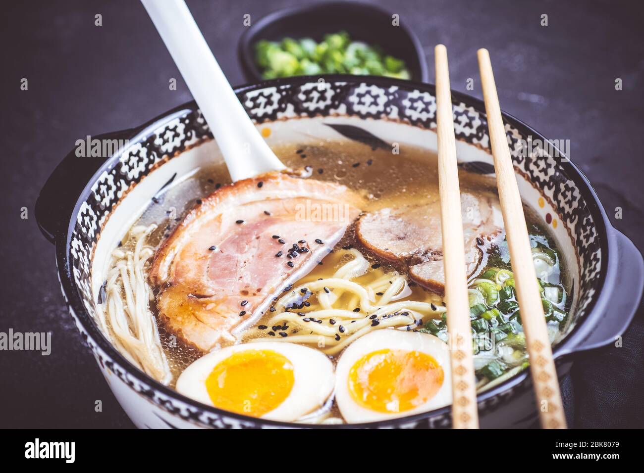 Japanese Traditional Ramen Soup with Pork, Eggs and Homemade Udon Noodles Stock Photo