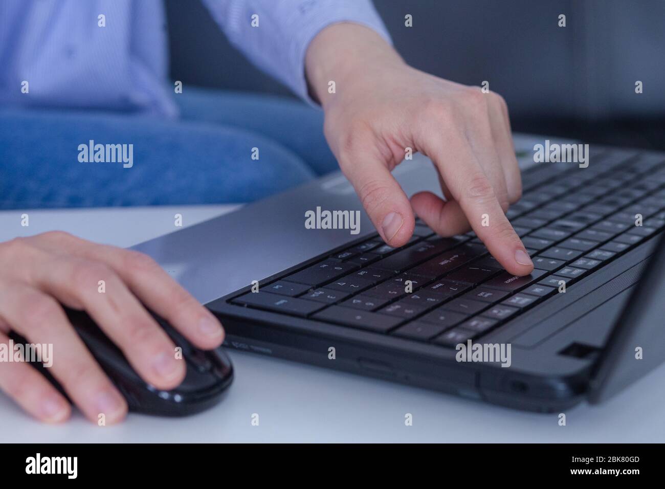 Businesswoman typing on laptop at workplace Woman working in home office hand keyboard Stock Photo