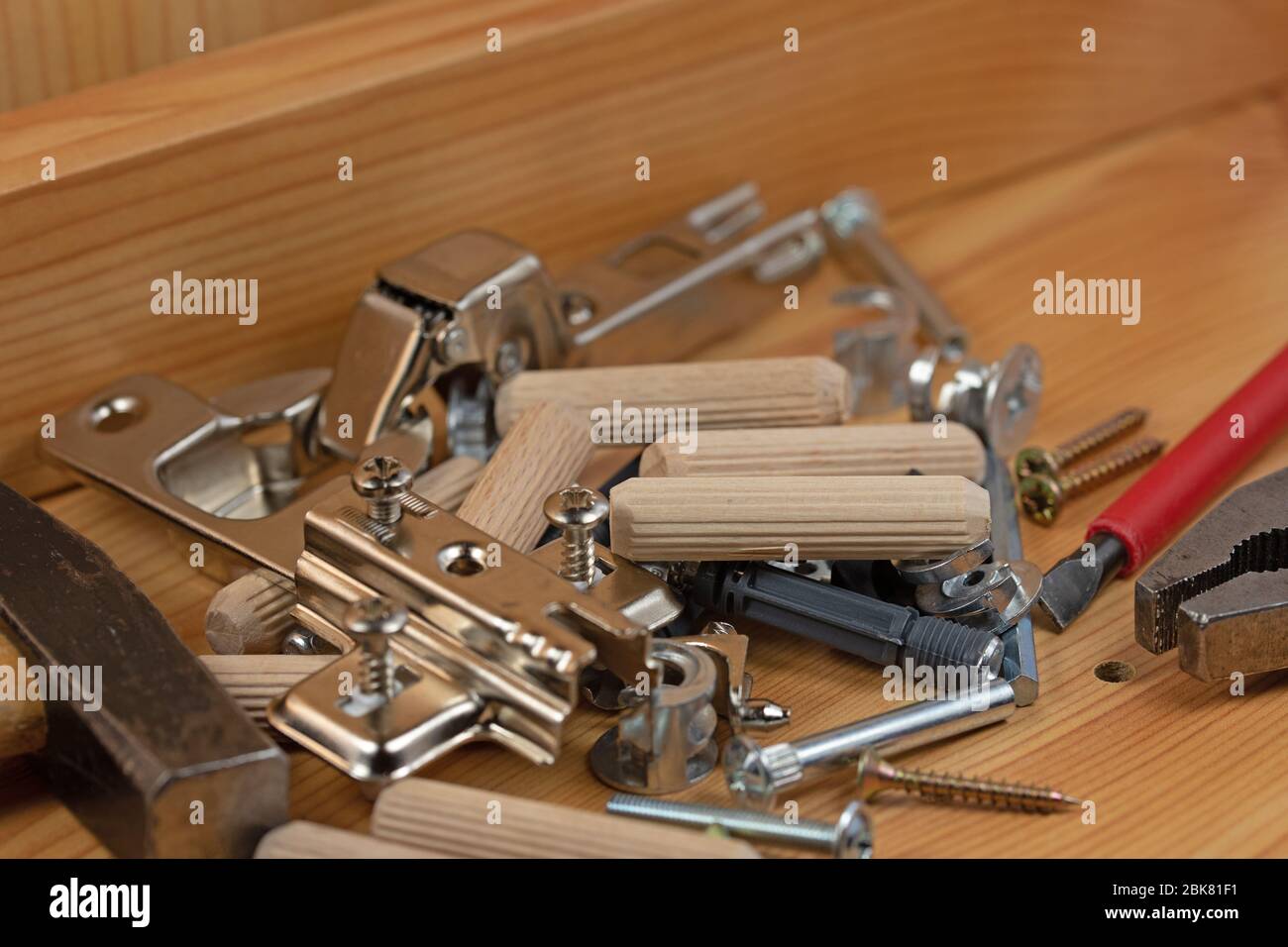 Various furniture fittings and assembly utensils in a closeup Stock