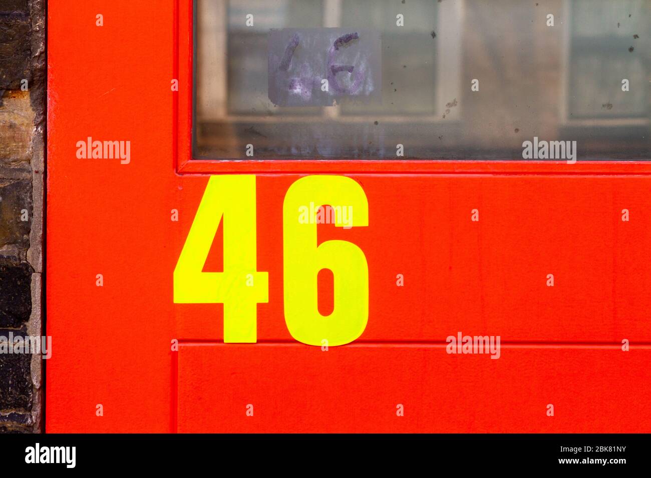 House number 46 in neon Stock Photo