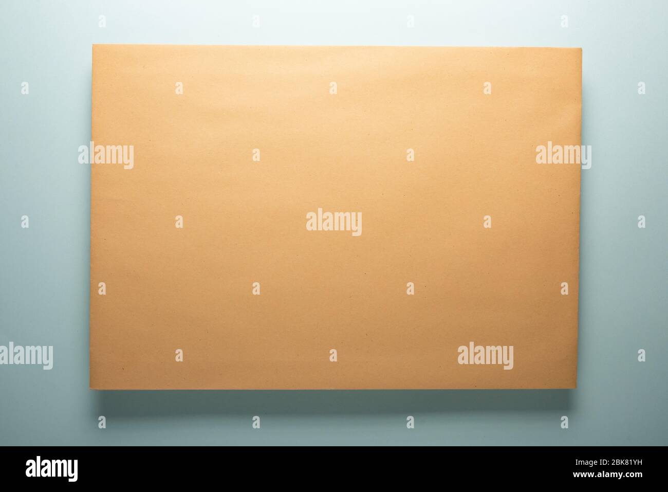Yellow paper envelope with shadow. Paper texture. Stock Photo