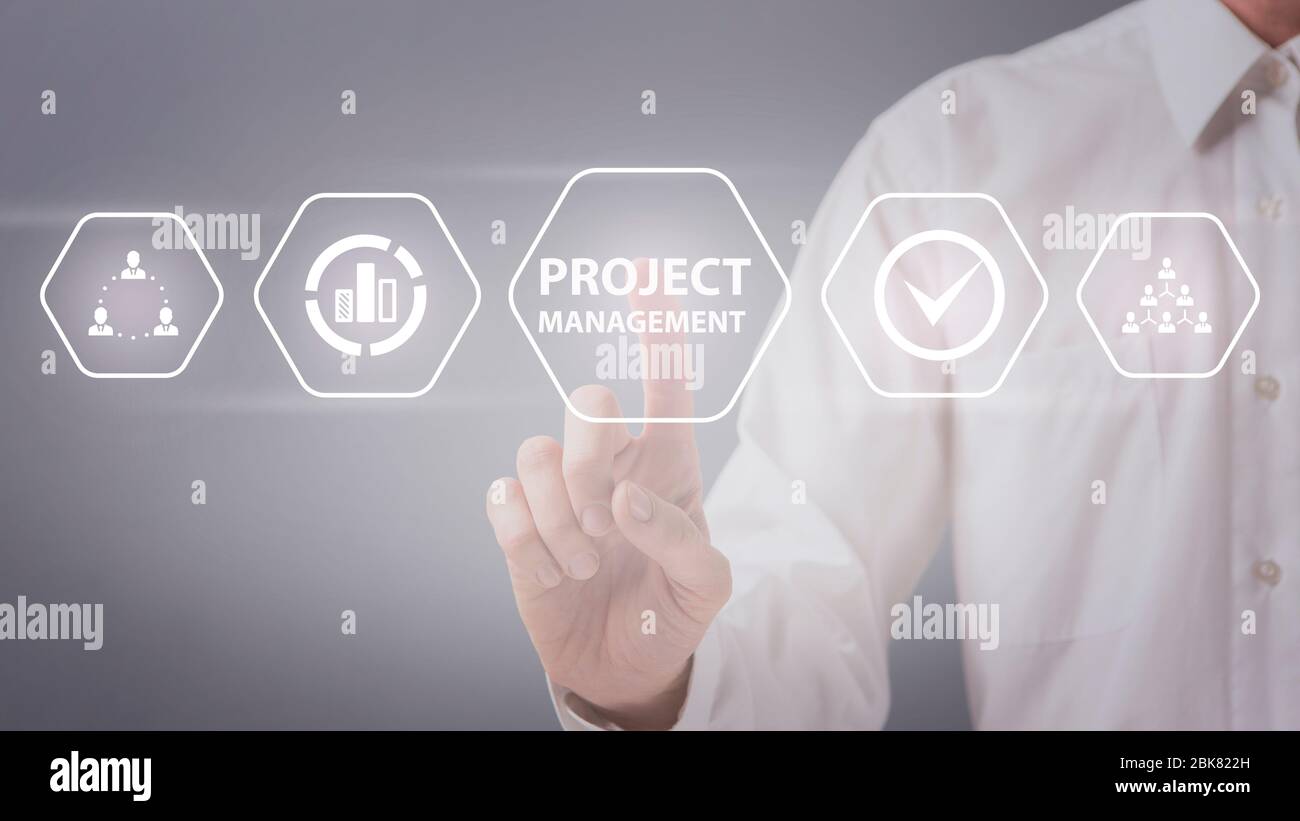 Man choosing project management button on virtual screen Stock Photo