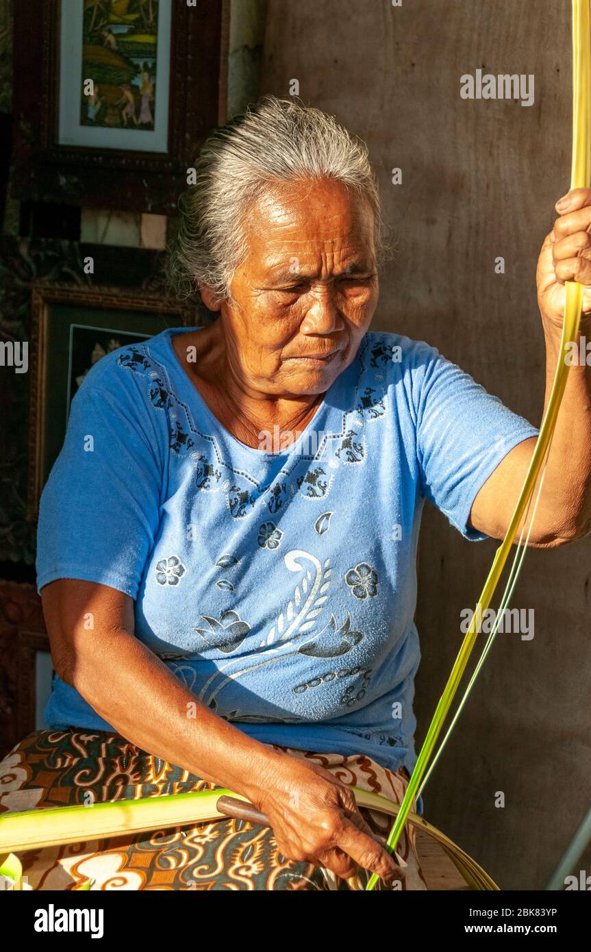 Elderly woman weaving reed basket Ubud Bali Indonesia Stock Photo Alamy