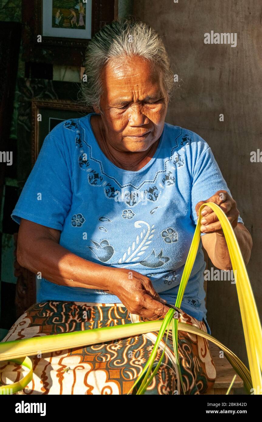 Elderly woman weaving reed basket Ubud Bali Indonesia Stock Photo Alamy