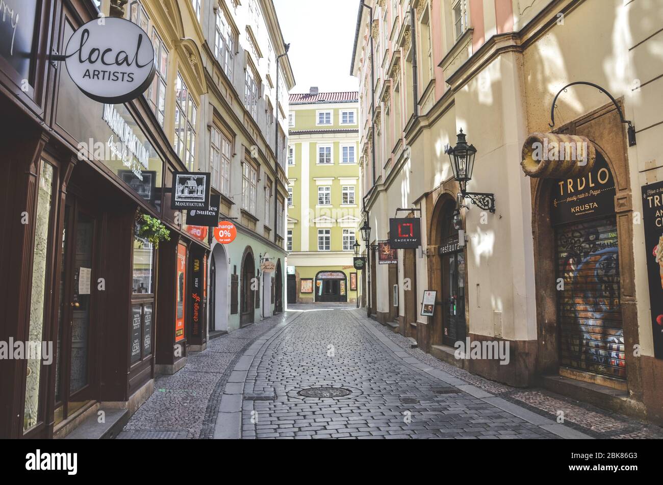 Prague, Czech Republic - April 23, 2020: Empty street in the historical center of the Czech capital. Closed shops and restaurants due to coronavirus outbreak. Empty city, COVID-19 pandemic. Stock Photo