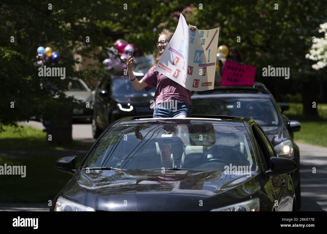 Potomac, United States. 02nd May, 2020. Friends line up to congratulates  Sami Snow during a surprise drive-by Bat Mitzvah celebration in Potomac,  Maryland on Saturday, May 2, 2020. The family held a