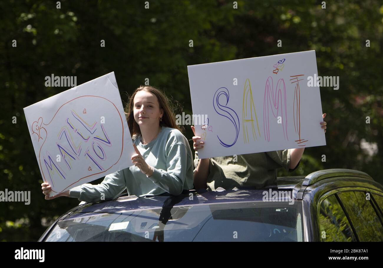 Potomac, United States. 02nd May, 2020. Friends line up to congratulates  Sami Snow during a surprise drive-by Bat Mitzvah celebration in Potomac,  Maryland on Saturday, May 2, 2020. The family held a