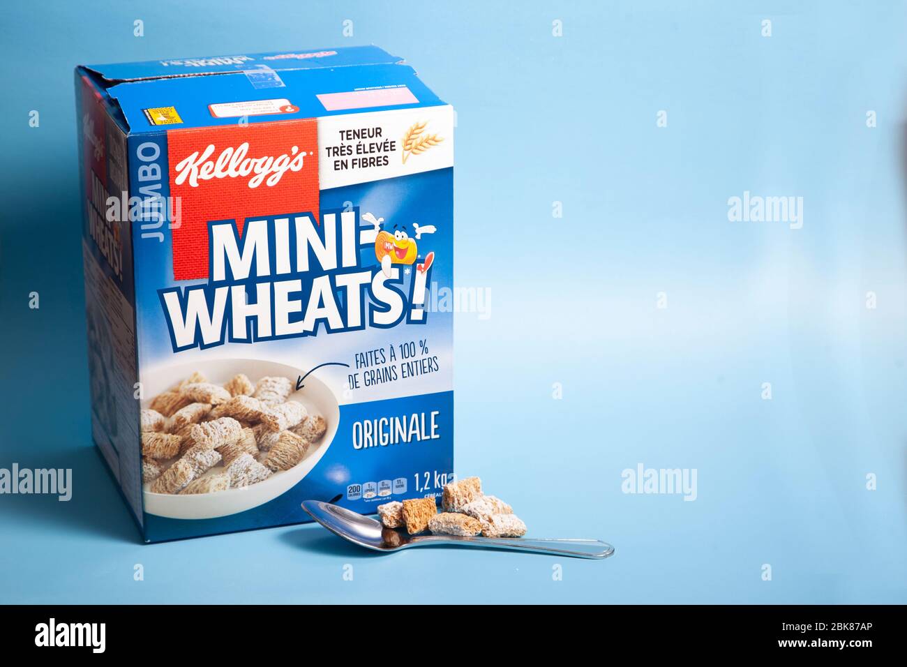 April 11, 2020 - Halifax, Canada: a huge box of delicious frosted Mini-Wheats cereal with a spoon Stock Photo