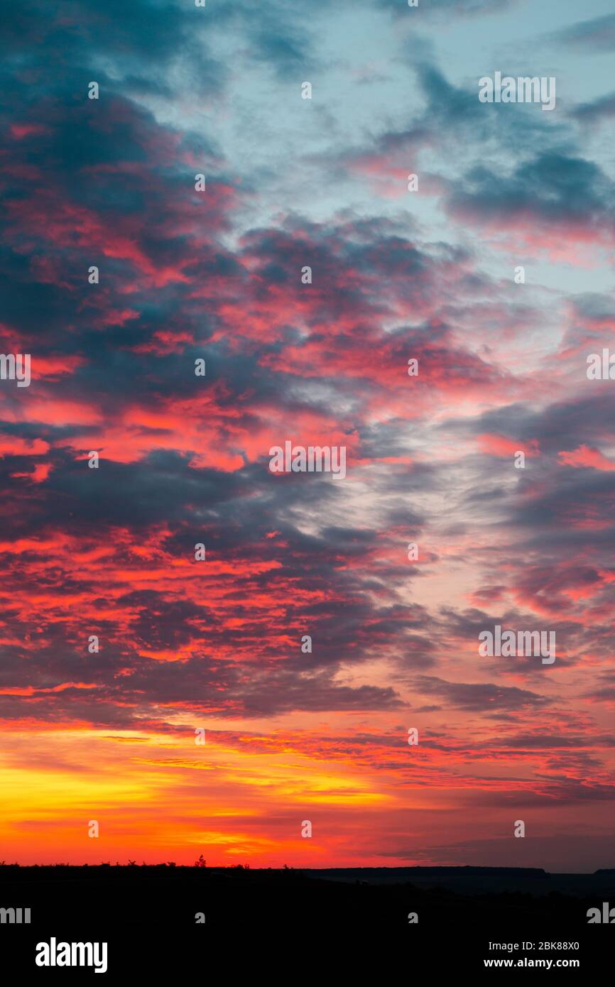 Beautiful fiery orange sunset sky with horizon Stock Photo - Alamy