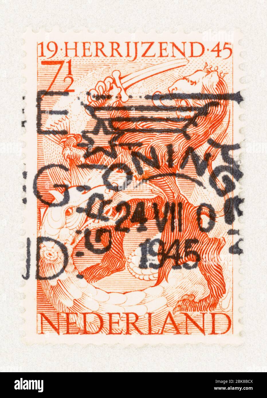 SEATTLE WASHINGTON - May 1, 2020: 1945 Dutch Republic Lion with sword slaying dragon, with bold black Groningen postmark. Scott # 277 Stock Photo