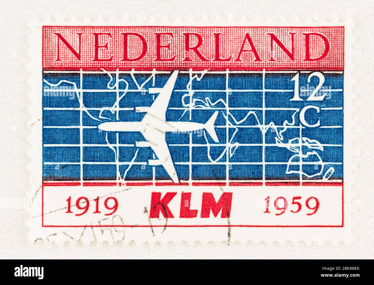 SEATTLE WASHINGTON - May 1, 2020: Stamp of Netherlands featuring Douglas DC-8 airliner with map background. Scott # 381. Stock Photo