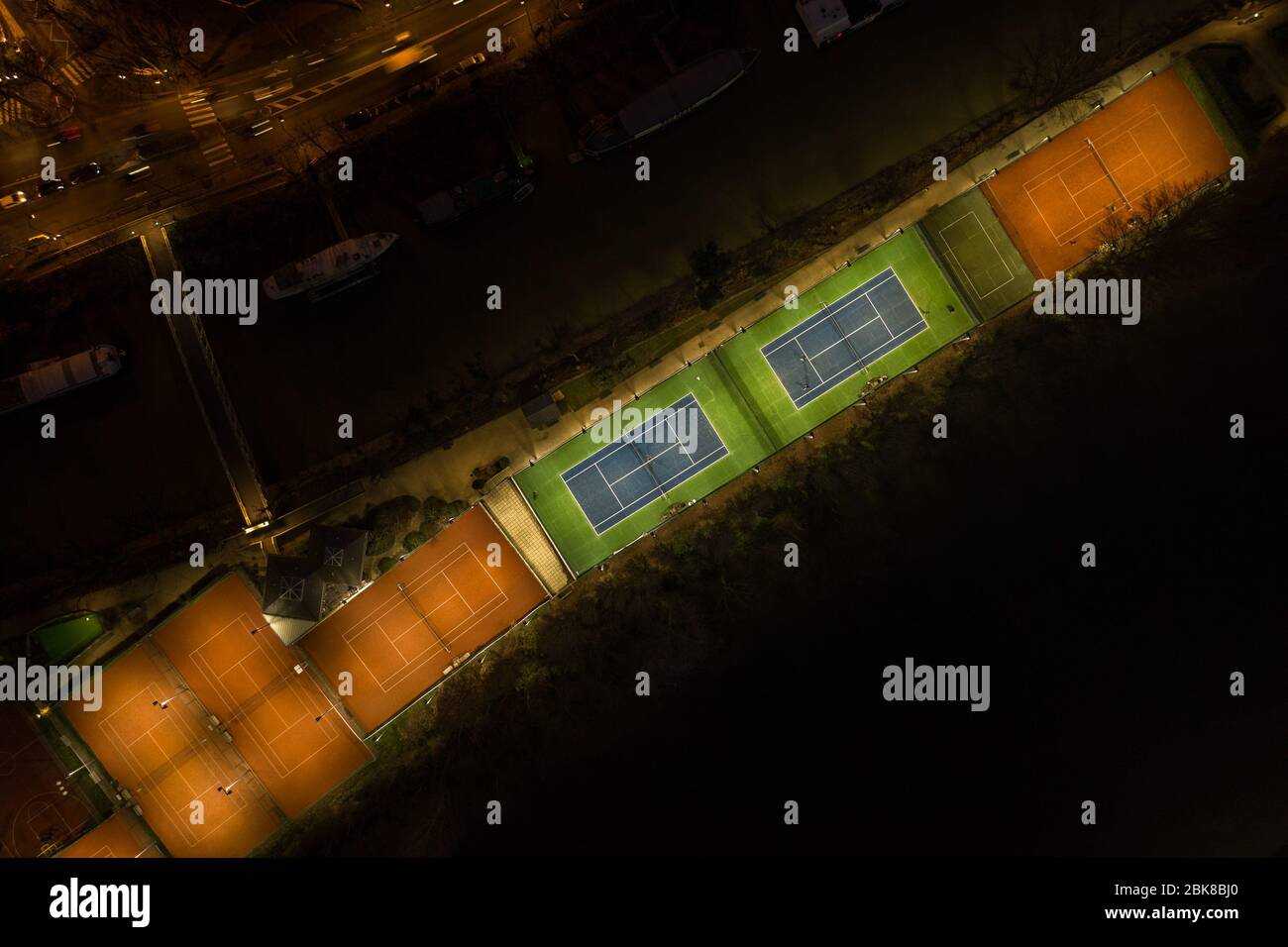 Aerial overhead night shot tennis light on courts of Neuilly Tennis Association on Ile de la Jatte in Paris France Stock Photo