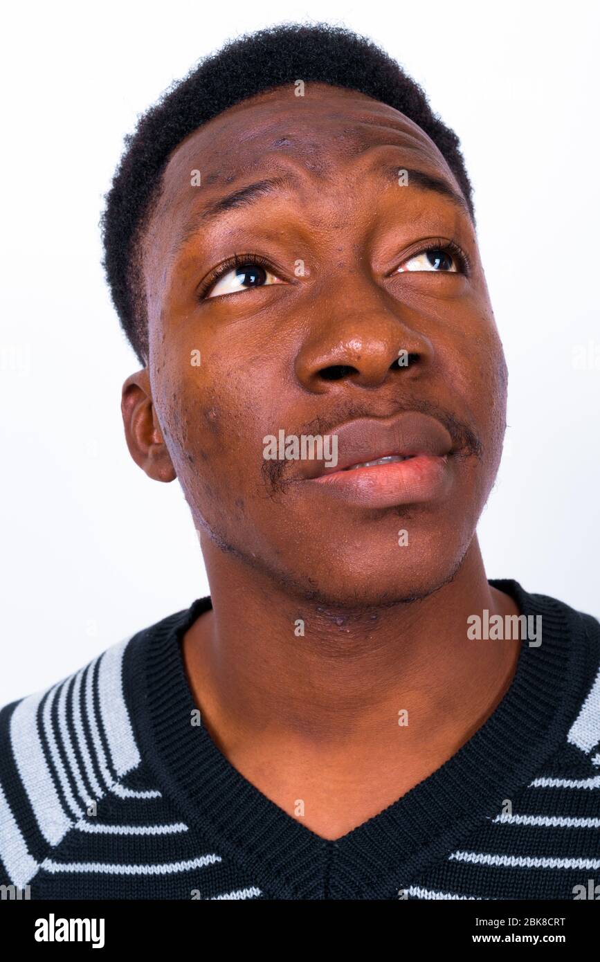 Young handsome African man against white background Stock Photo - Alamy