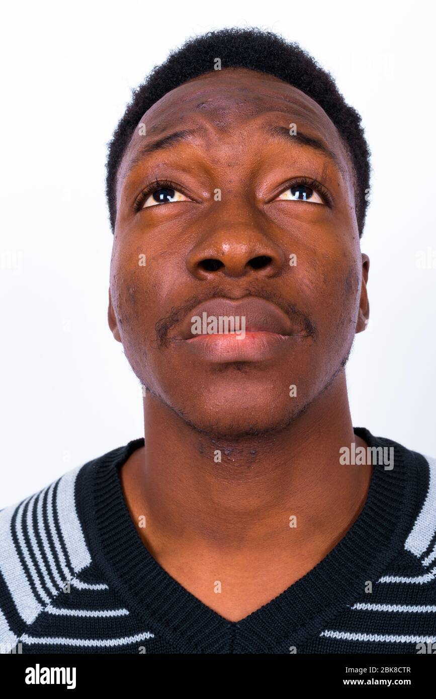 Young handsome African man against white background Stock Photo - Alamy