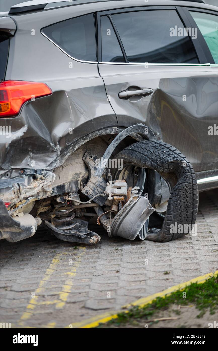 Wrecked tire of vehicle after car accident backside view Stock Photo