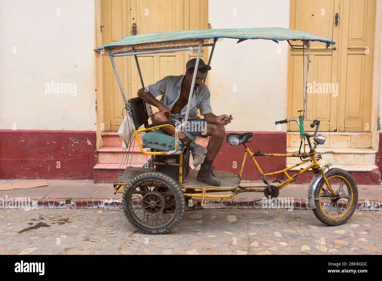Bici taxi waiting in UNESCO World Heritage Trinidad, Cuba Stock Photo -  Alamy