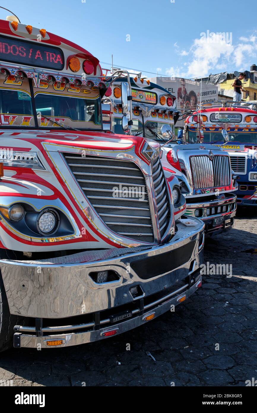 Old, well-kept bus, painted in colors and decorated, parked at the Chichicastenango station. Stock Photo