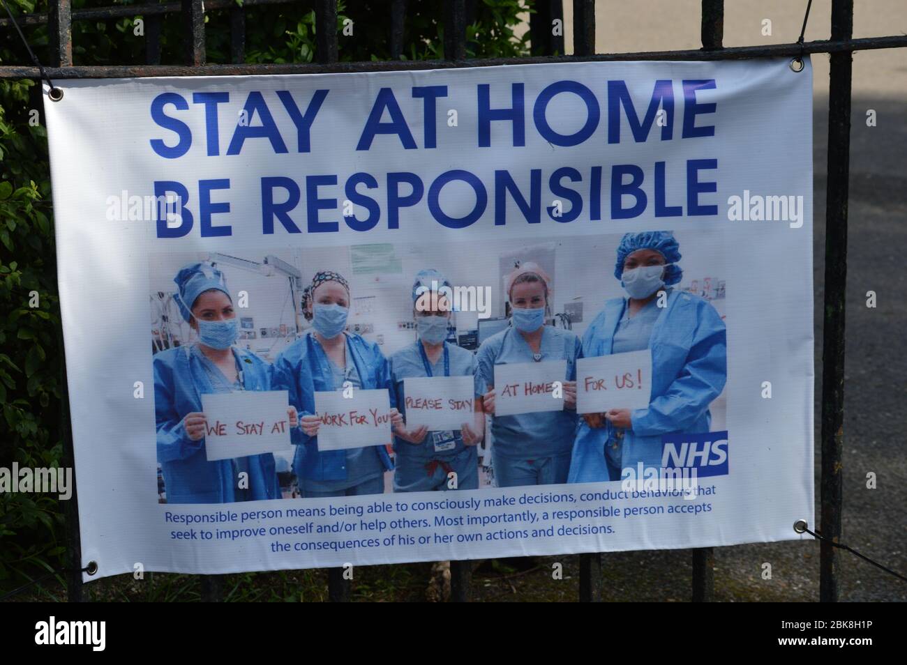London, UK. 1 May, 2020. A message displayed from the NHS to the public - Stay at Home, Be Responsible at Acton Green Common. Stock Photo