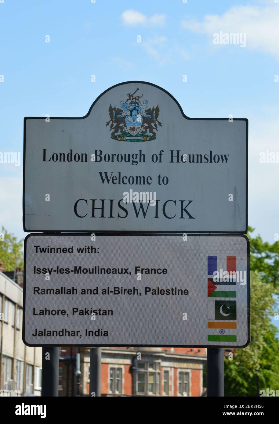 London, UK. 1 May, 2020. Sign welcoming visitors to the town of Chiswick, with the twinned cities and towns listed. Stock Photo