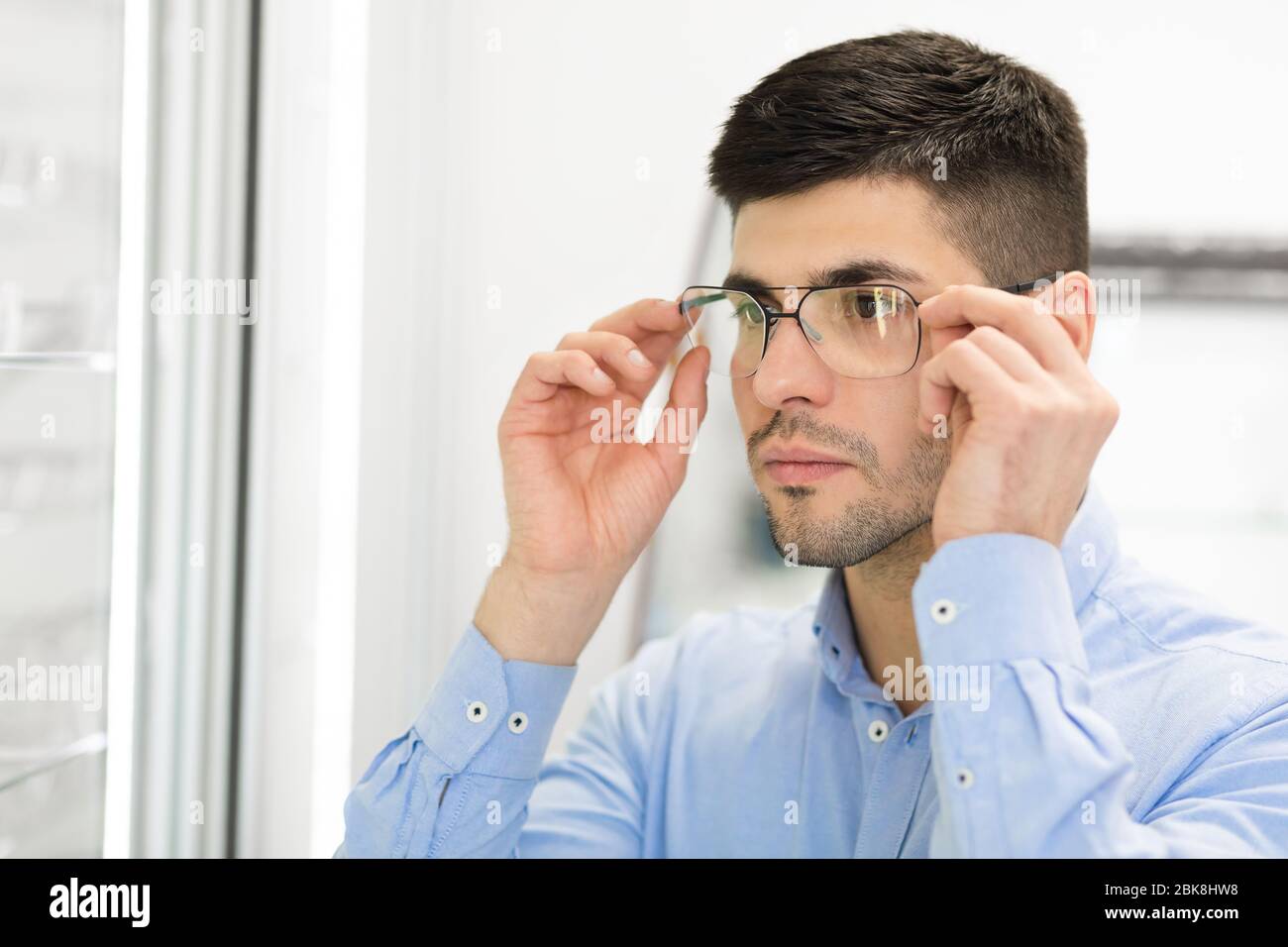 Portrait of handsome young guy wearing spectacles Stock Photo - Alamy