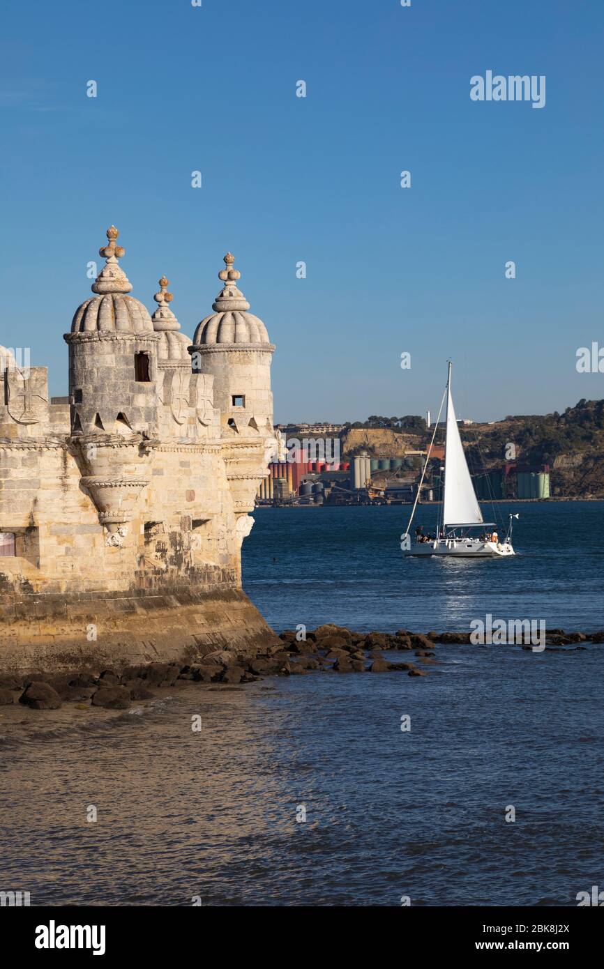 Torre de Belem and sailboat on Tagus River, Lisbon Portugal Stock Photo