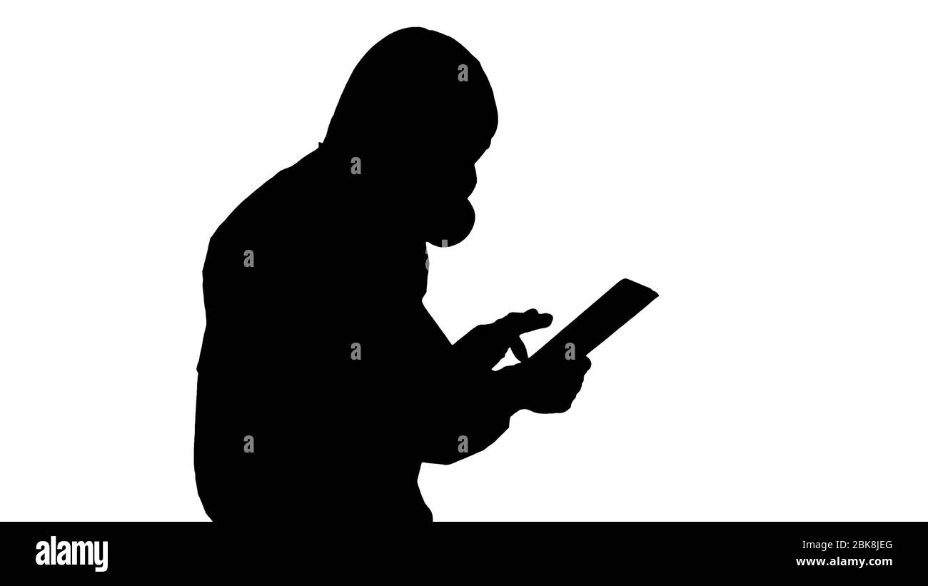 Silhouette Scientist or docrot wearing biohazard suits and protective masks using digital tablet while walking. Stock Photo