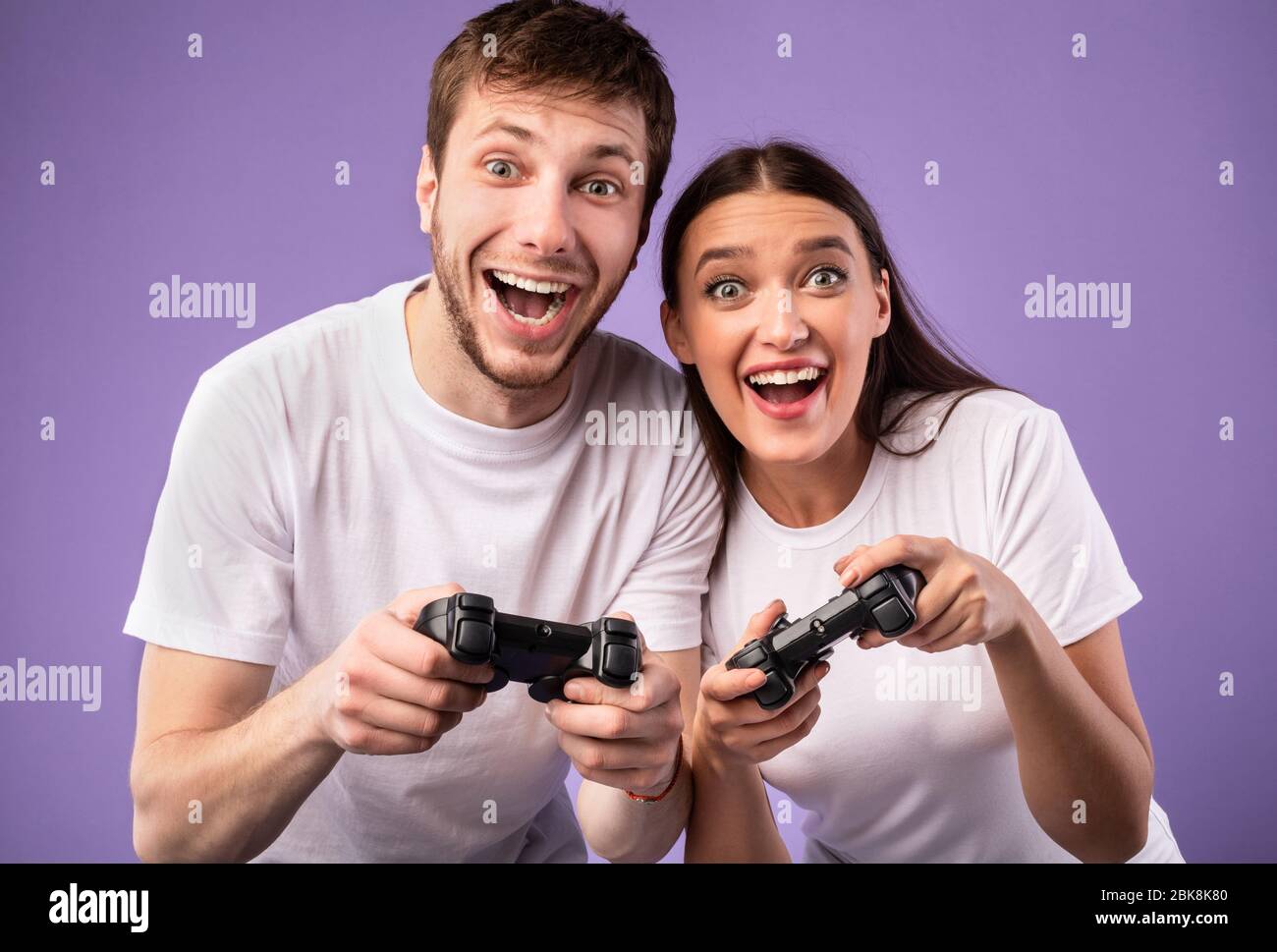 Young couple playing video games hi-res stock photography and images ...