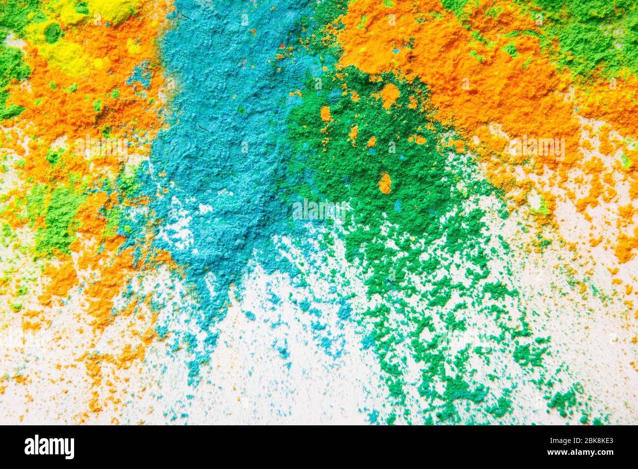Green, orange, blue and yellow powder for Holi Stock Photo