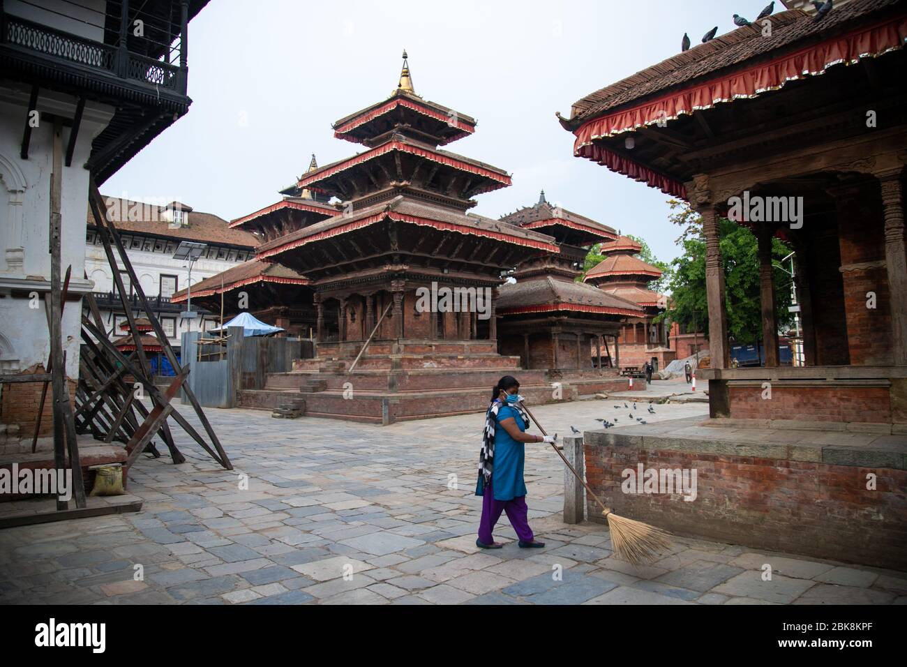 May 1, 2020, Kathmandu, Nepal: A female worker cleans the Kathmandu durbar square area during the International labour day amid the nationwide lockdown imposed by the government amid concerns about the spread of the coronavirus disease (COVID-19).On the occasion of International Workers Day or Labour Day is observed all over the world on the first day of May, the history of this day dates back to the 19th century, when revolutions took place in the United States. It was during the rise of industrialisation that the labour-class was oppressed to the point of having to take a stand. (Credit Ima Stock Photo