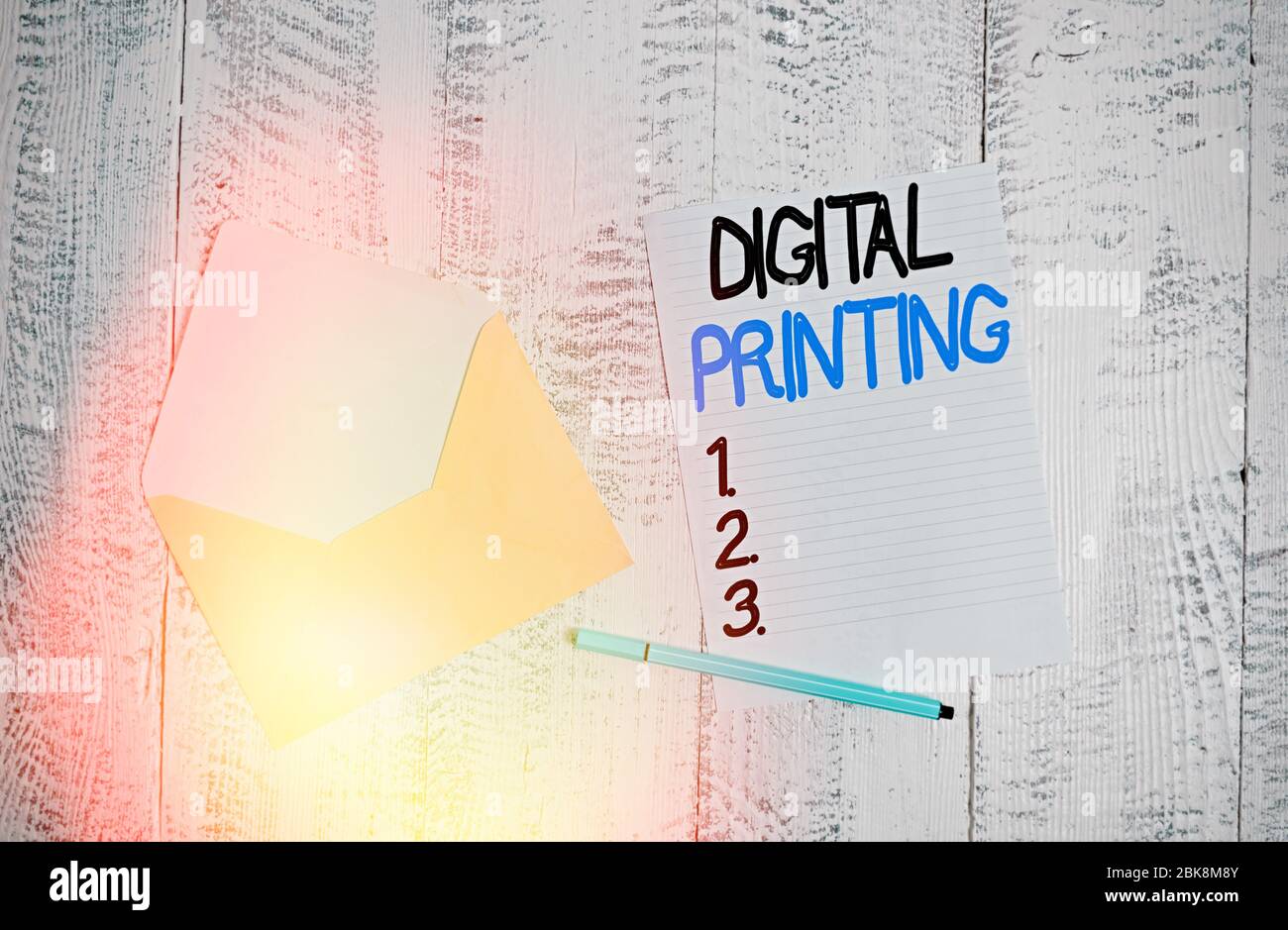 Text sign showing Digital Printing. Business photo showcasing digital based images directly to variety of media Open colored envelope blank sheet lett Stock Photo