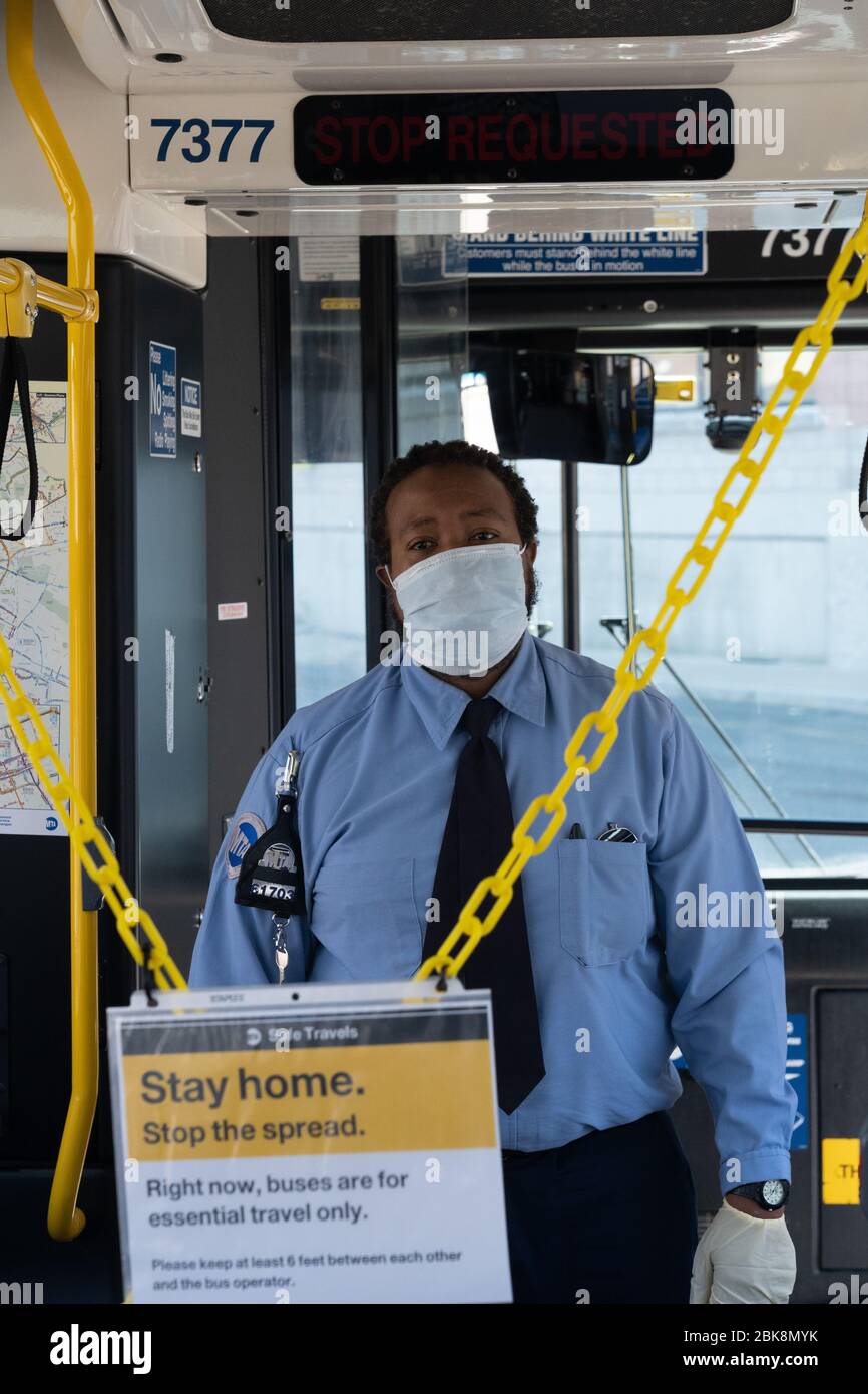 NEW YORK, NY - MAY 2, 2020:  pose on his bus at a MTA maintenance facility amid the COVID-19 pandemic. Stock Photo