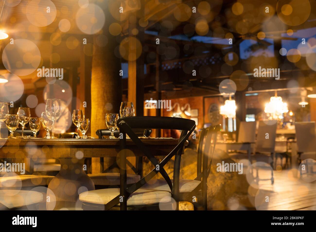 Interior  restaurant with warm lighting and empty tables Stock Photo