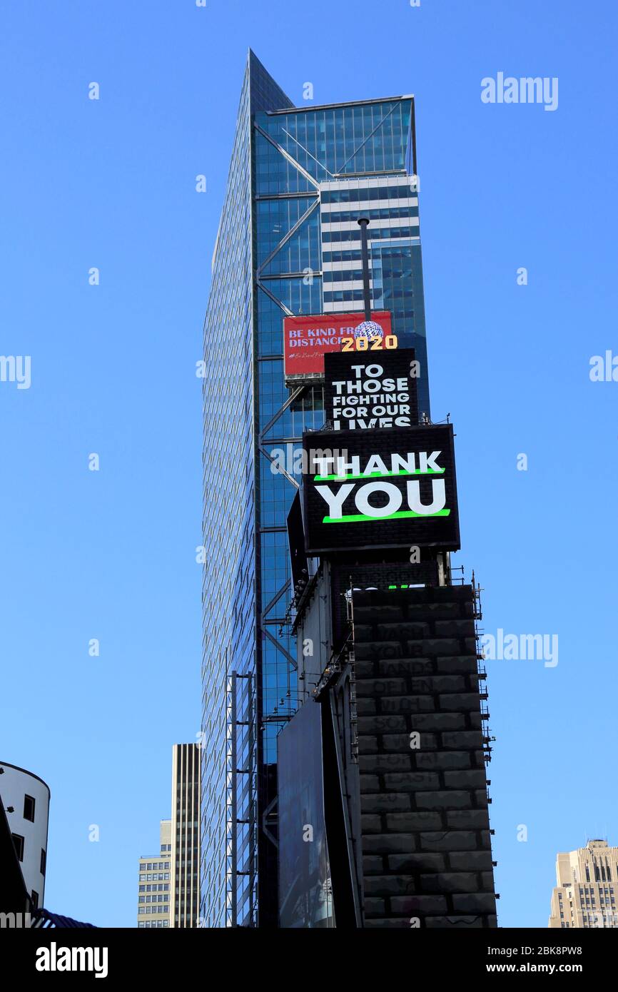 Billboards thanking essential workers in empty Times Square during coronavirus pandemic, New York City, May 1, 2020 Stock Photo