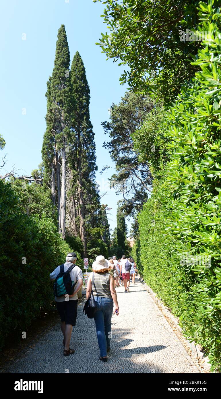 Tourist walking on the Path of Paradise on Lokrum island near Dubrovnik, Croatia. Stock Photo