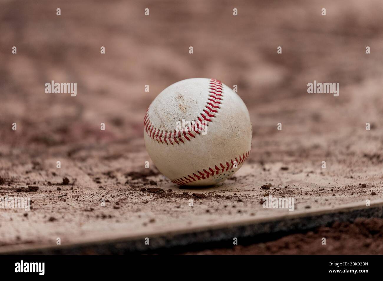 Baseball on a dirt baseball field Stock Photo