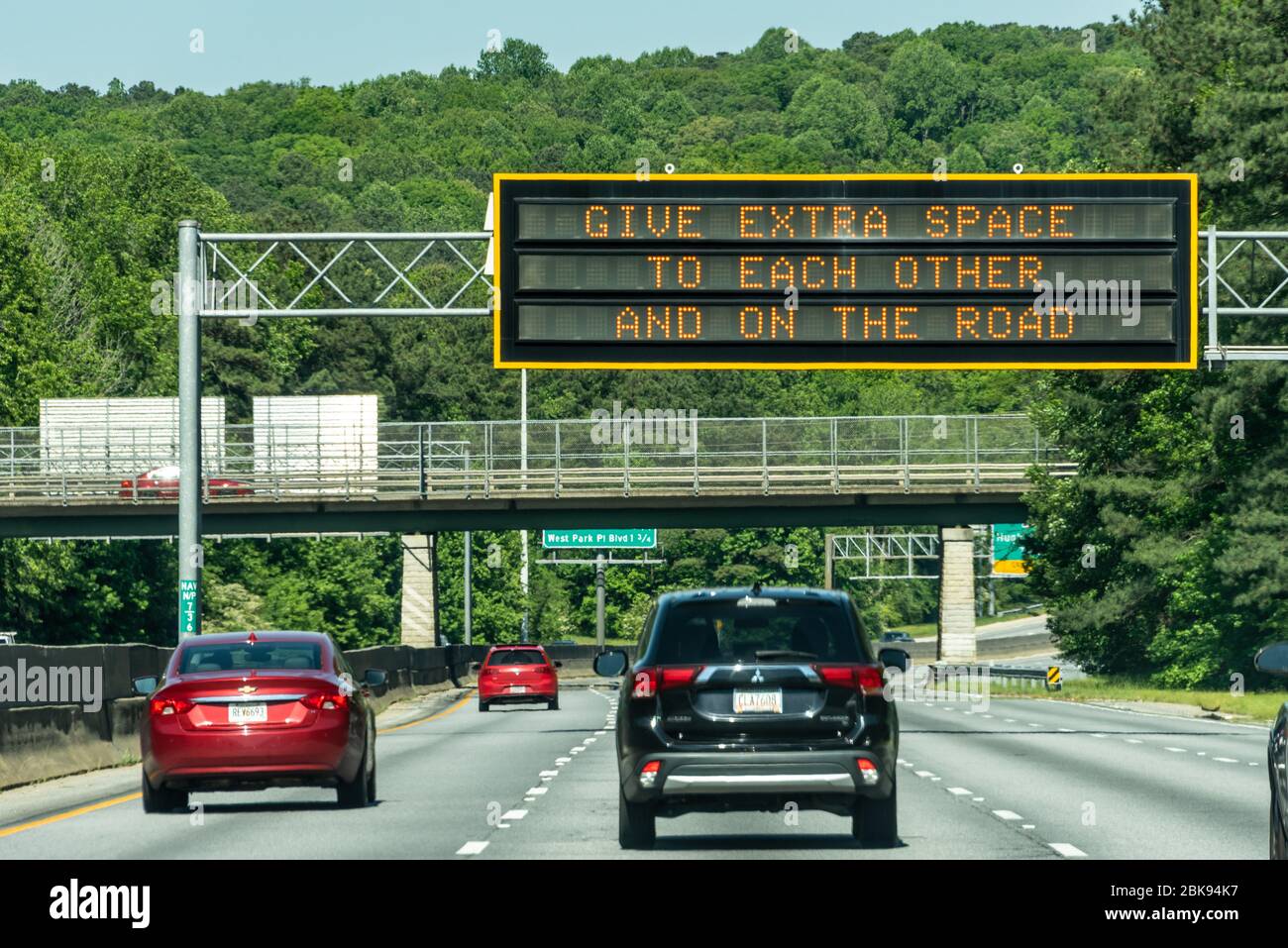 Social distancing overhead highway message sign on Highway 78 in Atlanta, Georgia. (USA) Stock Photo