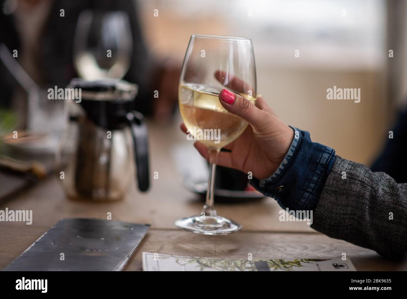 Woman glass wine in hand hi-res stock photography and images - Alamy